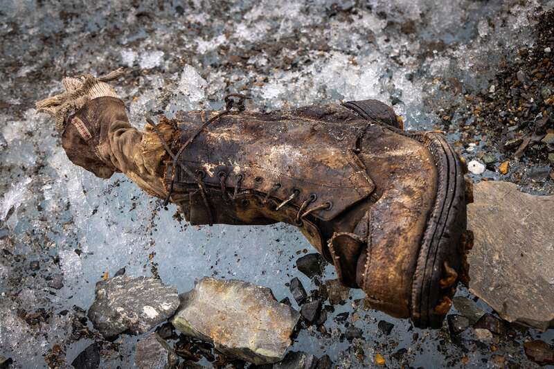 A boot emerging from the ice on Mount Everest